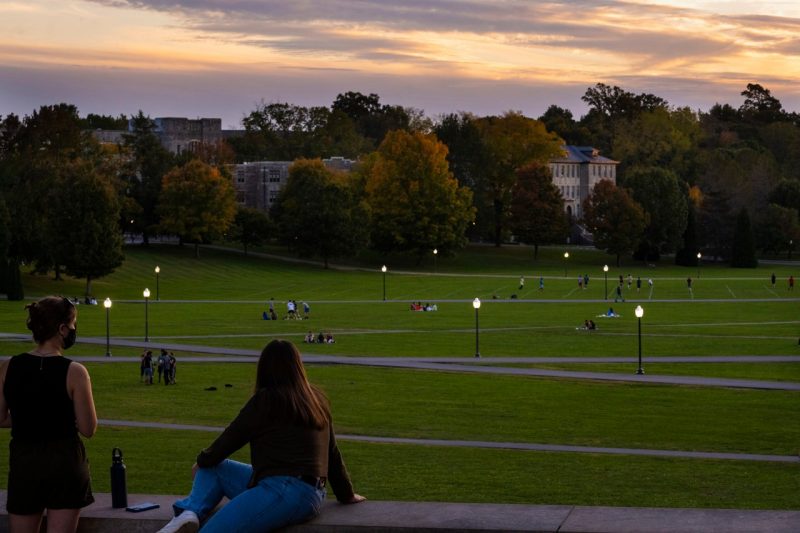 people looking at campus at sunset
