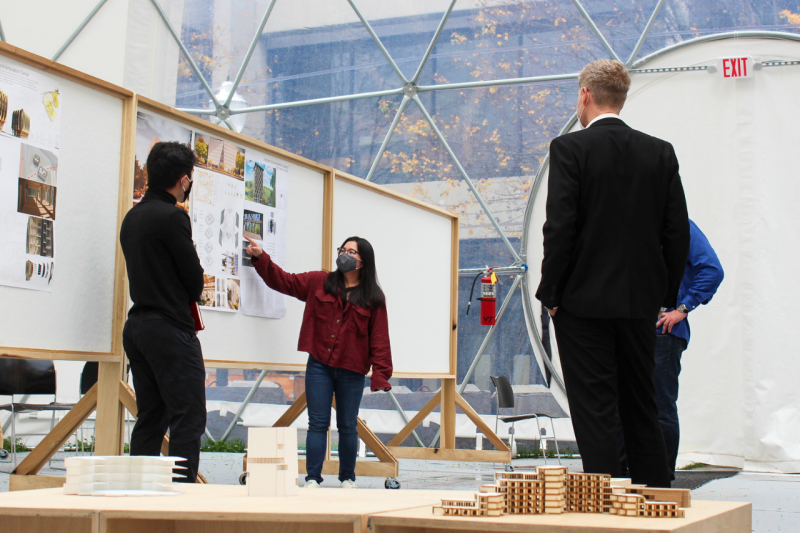 Architecture students present their work for critique in the Cowgill dome