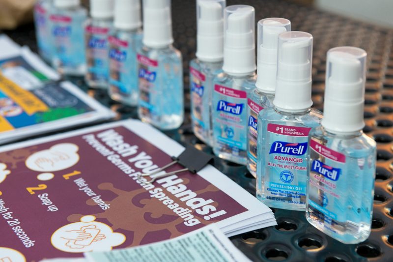 Picture of hand sanitizer and other public health guidelines 