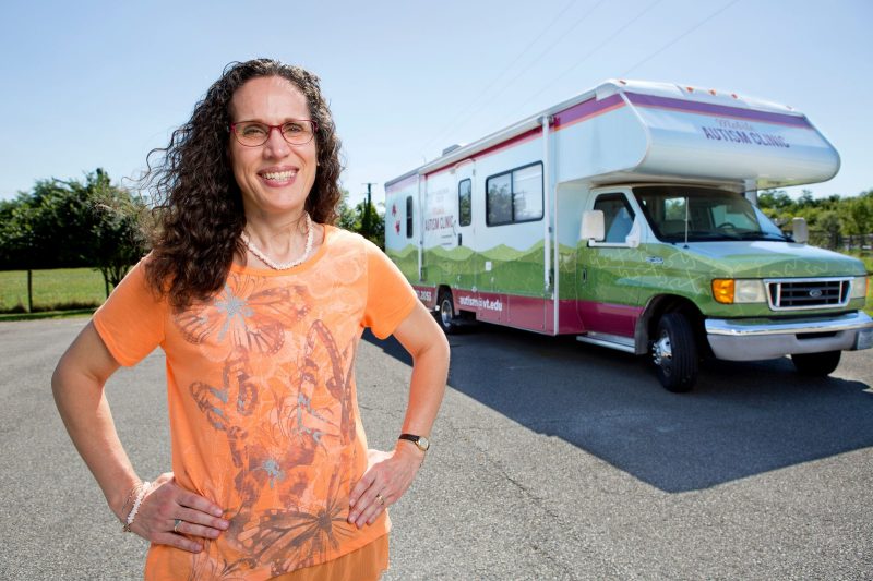 Angela Scarpa standing outside of the Mobile Autism Clinic