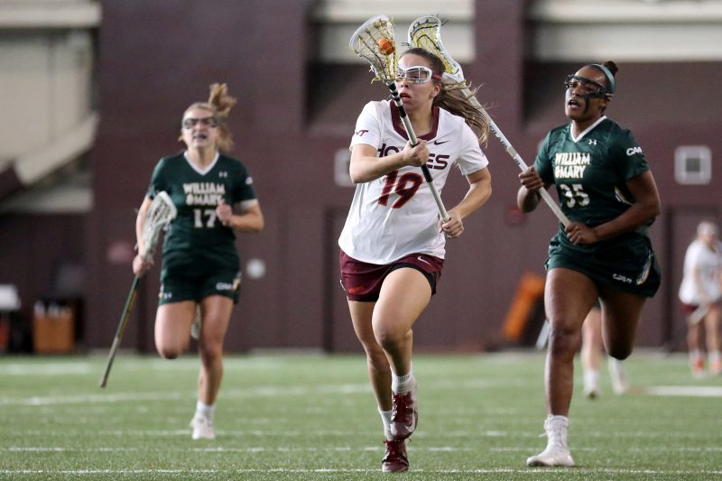 Jacelyn Lazore moving down the field in Virginia Tech's lacrosse game against William & Mary